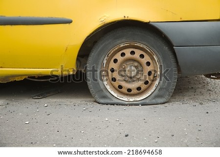 Flat tire of an old car
