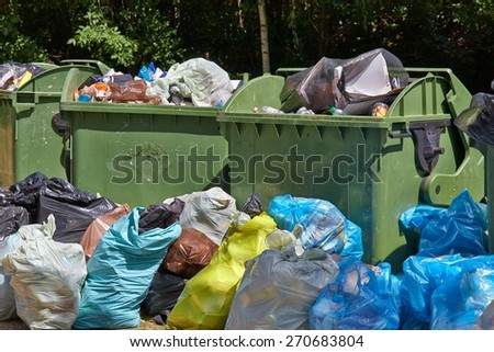 Dumpsters being full with garbage