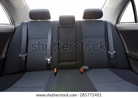 Car backseats with intentional light flare from the burnt out background