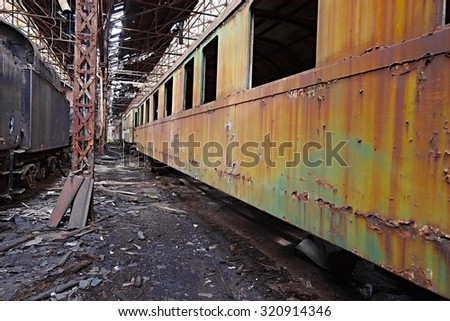 Abandoned train carriage in a decaying depo