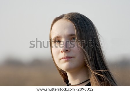 portrait of a girl with long hair in the wind
