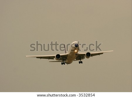 Commercial airplane landing in the evening