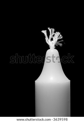 White candle isolated on black