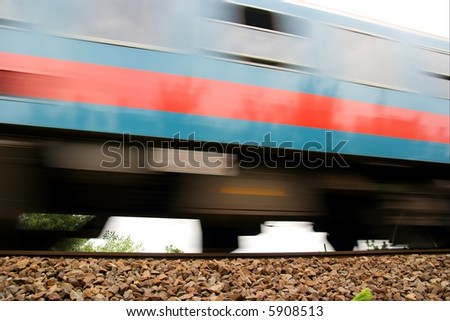 Fast passenger train passing by with motion blur