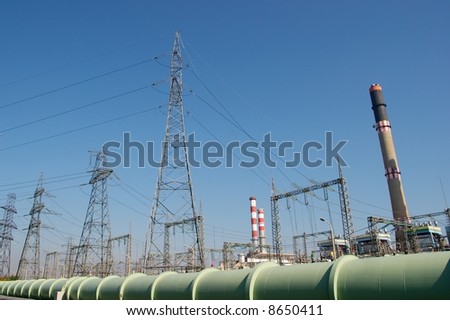 Electric power station against clear blue sky