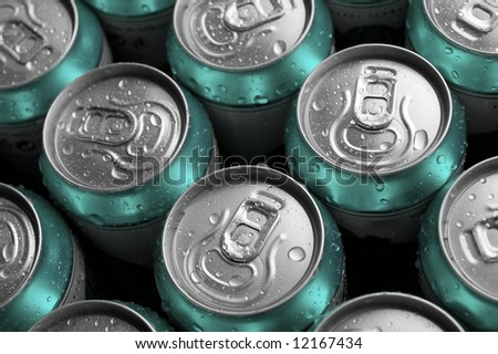 Many cans of cold beer with condensed water droplets