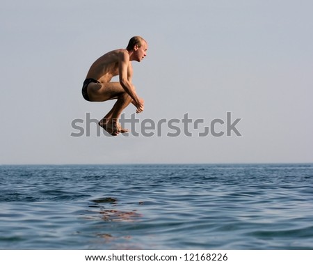 Man jumping into the sea
