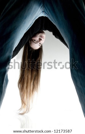 stock photo Young girl bending over and looking backwards