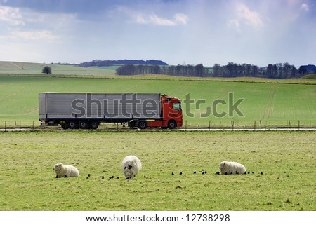 Truck passing by on a green agricultural field