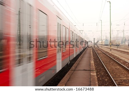 Passenger train passing by with motion blur