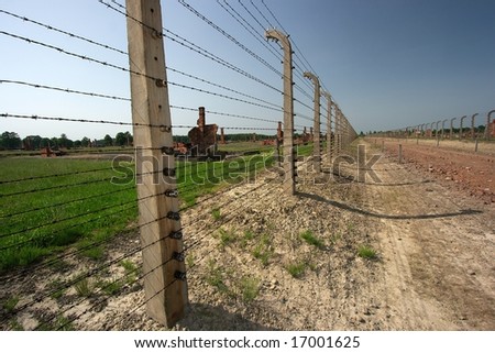 Ruins and barbed wire fences in Auschwitz