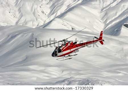 Mountain rescue helicopter on a snowy landscape