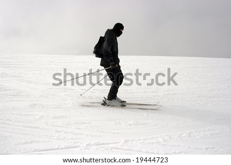 Skier sliding down the slope