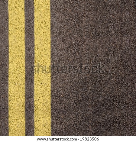 Double yellow line on asphalt texture