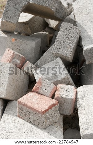 A pile of debris with concrete bricks