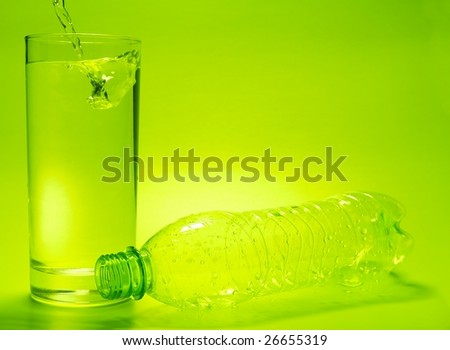 Glass full of water and empty bottle