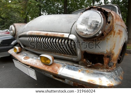 stock photo Old rusty wrecked car front