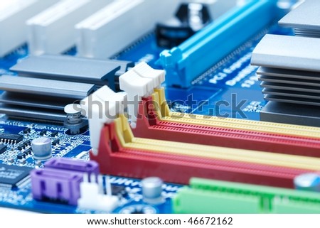 Computer mainboard closeup with lots of electronic components