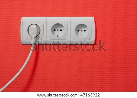 Electric outlets on red wall