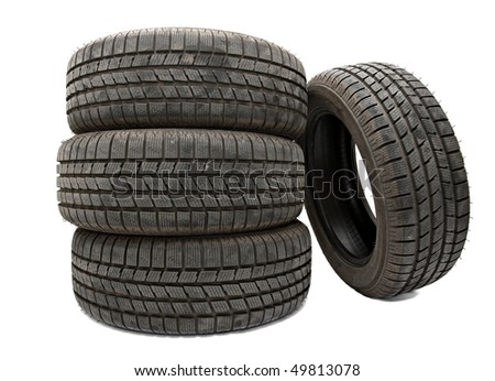 stock photo Car tyres in a pile isolated on white