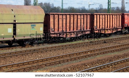 Old freight train wagons on railway tracks