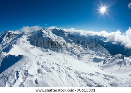 Snowy mountain landscape in sunny weather