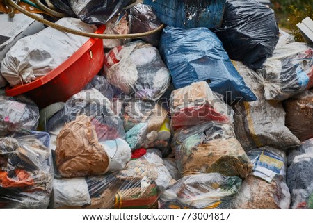 Garbage bags piled up in a hill