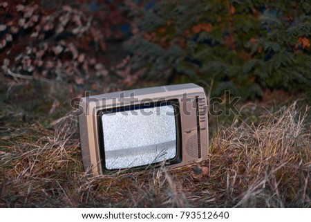 White noise on analogue TV set in outdoor environment