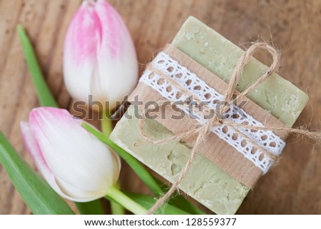 Selfmade soap and tulips. Gift idea. Shallow depth of field