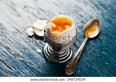 Open soft boiled egg in egg cup