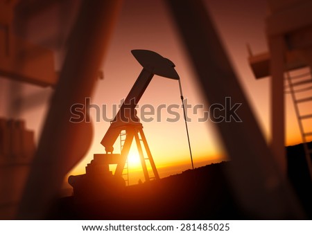 Oil and Energy Industry. A field of oil pumps against a sunset. Oil prices, energy and economic commodities.