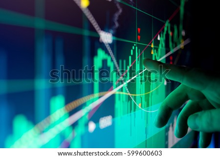 A city worker Analysing illustrated stock market financial  data on a screen.