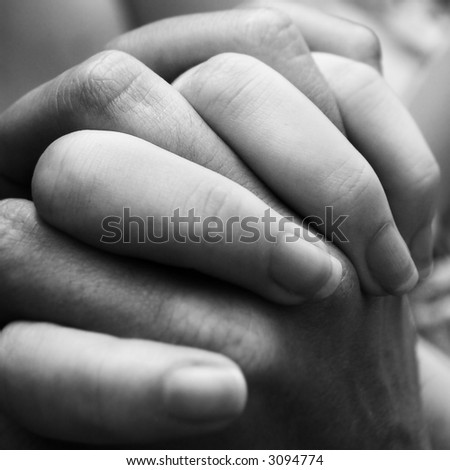 stock photo : A couple holding hands close up.