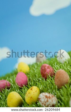 Macro shot of Easter eggs on grass.