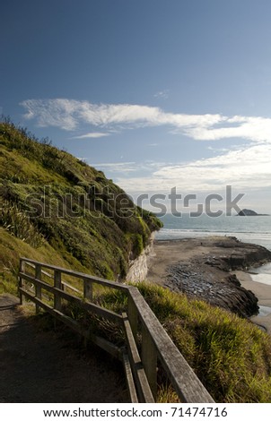 Wooden stairs and railing by the sea( Muriwai, New Zealand)