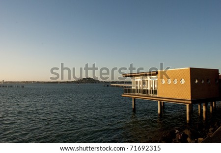 Brick Deck House on East Coast Bay at sunset