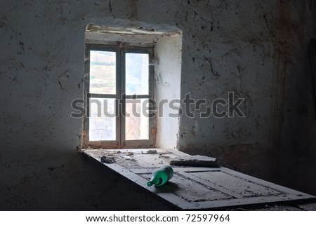 empty green bottle at abandoned place