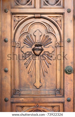 church door with cross and heart