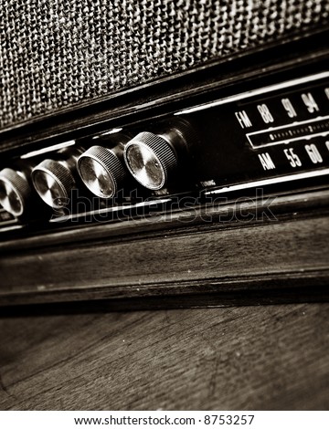closeup of vintage radio dial in sepia