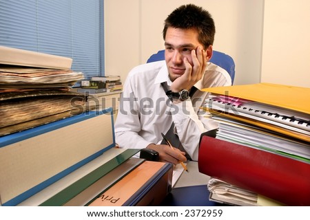 young, white callar worker on his job training  overloaded with work