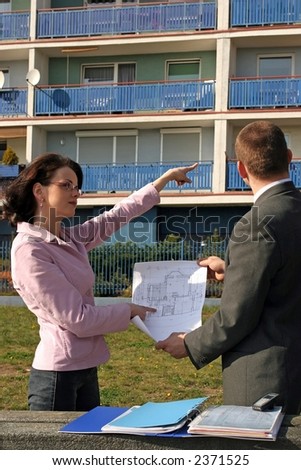 real estate agent showing flat location to potential client