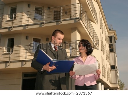 real estate agent showing flat location to potential buyer