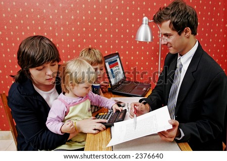 Bank manager with mother and her two children  wanting a loan