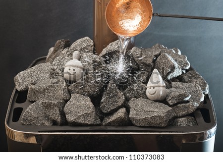 Finnish Sauna - Pouring water on the hot stones