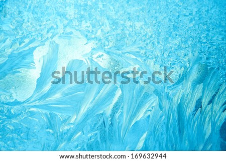 Beautiful texture of frozen glass, blue color