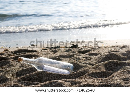 Bottle message on a sandy beach