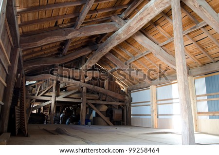 Wood framework and board of old barn inside in rural Japan