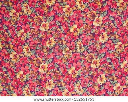 Flower pattern printed cloth as a background.