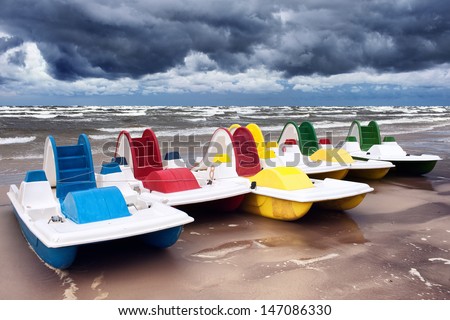 Pleasure boats on the shore of the Baltic Sea in the storm