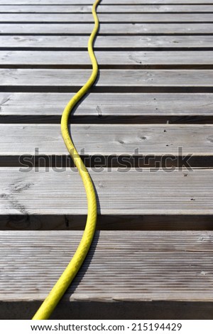Yellow hose lines terrace boards